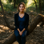 Woman sitting on a tree branch in a forest